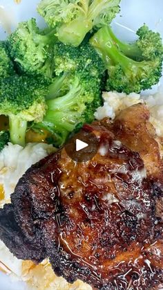 broccoli and meat on a plate with mashed potatoes, gravy