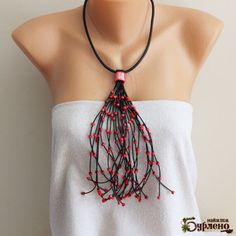 Necklace with wooden and ceramic beads in red colour. The pendant can be spread aside. The cord is made of genuine leather in black color. The length of the necklace is 48 cm (19 inches) without the pendant. The length of the pendant is 23 cm (9 inches). The total length of the necklace is 71 cm (28 inches).  Your purchase comes in a gift box. International orders will take between 5-20 working days to arrive, but can take longer during the holidays! Red Hand-strung Long Beaded Necklace, Red Long Hand-strung Beaded Necklace, Red Multi-strand Beaded Necklace With Large Beads, Multi-strand Red Necklace With Wooden Beads, Luxury Hand-strung Red Beaded Necklace, Organic Necklace, Asymmetrical Necklace, Art Necklaces, Long Beaded Necklace