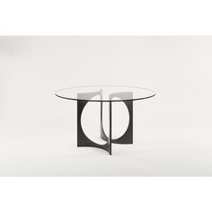 an oval glass table with black metal legs and a circular glass top, on a white background