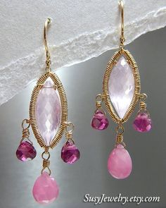 Oh how I LOVE the color pink (can you tell?). If you love the color pink like I do--you will want these elegant earrings. Large faceted rose quartz marquise beads are adorned with pink sapphires and pink tourmaline teardrops dangling from a 14k gold-filled wire wrapped frame. A special gift for someone you love or just a treat for yourself...these earring are a must have. Details Handmade item Ships from Texas Length: 1.75 Inches; Width: .5 Inches Materials: Gold filled, Sapphire, Rose quartz, P Garden Earrings, Tourmaline Quartz, Quartz Pink, Wire Wrapped Earrings, Wire Earrings, Rose Earrings, Simple Jewelry, Rose Garden, Elegant Earrings