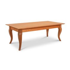 a wooden table sitting on top of a white floor