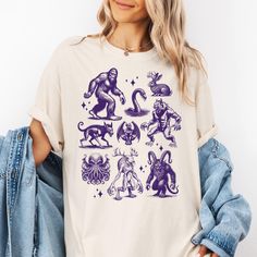 This Cryptozoology Comfort Colors T-Shirt is a must-have for mythology lovers and fans of cryptid folklore. Featuring various mythical creatures like bigfoot, werewolf, chupacabra, cthulhu, and more, this retro cryptidcore tee delivers a vibe of mystery and fantasy. Perfect for casual wear and unique gifting, this shirt is relevant to myth enthusiasts and fans of weirdcore fashion. Ideal for celebrating Halloween, spooky events, or as a quirky everyday statement piece. The shirts are heavyweight Affinity Designer, Comfort Colors Shirt, Cthulhu, Looks Vintage, Mythical Creatures, Tshirt Colors, Vintage Looks, Comfort Colors, San Jose