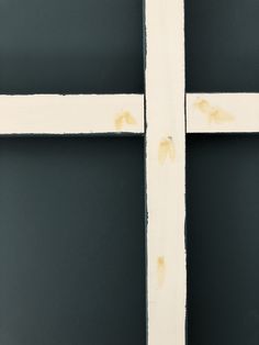 the cross is painted white and has brown paint