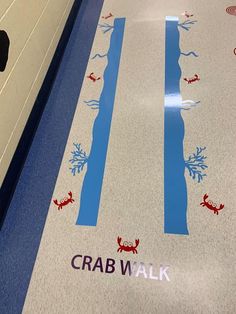 a hallway with blue and white flooring that says crab walk on the bottom line