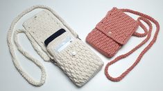 two crocheted purses sitting next to each other