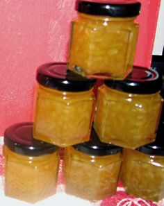 a stack of jars sitting on top of a table