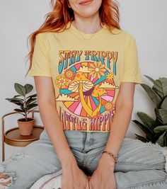 Stay trippy little hippie! Show your free spirited side with this awesome mushroom tee printed on a comfort color shirt. Order a size or two up for that trendy oversized shirt look!  Professionally printed t-shirts, perfect for anyone looking for comfortable and stylish everyday wear. Our t-shirts are made from 100% cotton (excluding heather colors) and feature a comfortable, relaxed fit that's perfect for any occasion. With a variety of trendy designs to choose from, there's a t-shirt for everyone in our collection. Features: Professionally printed designs for a high-quality finish Comfortable, relaxed fit for all-day comfort Made from 100% cotton (excluding heather colors and tank tops) Unisex fit that's perfect for everyone Size chart available in the images for accurate sizing Processi Groovy Mushroom, Stay Trippy Little Hippie, Festival Shirt, Hippie Shirt, Shirt Stays, Festival Shirts, Hippie Festival, Comfort Color, Retro Shirts