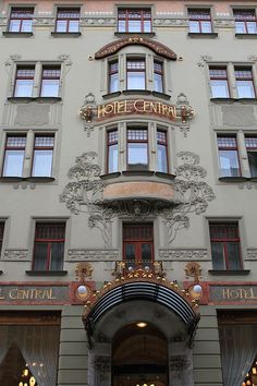 the hotel central is located in an old european style building with ornate decorations and gold trimmings