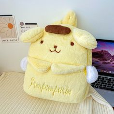 This Pompompurin backpack is more than just a carry item; it’s a nod to all things cute and playful in the kawaii culture. Its plush exterior promises comfort and adds a dash of charm to any ensemble, making it an ideal pick for those who adore cute anime bags. Designed to delight fans of all ages, this pompompurin plush backpack is your go-to for a mix of fun and functionality, ensuring you or your little one shines in any crowd. Dive into the cute world of kawaii with the Pompompurin Plush Bac Pompompurin Backpack, Big Squishies, Cute Pompompurin, Pompompurin Plush, Kawaii Culture, Anime Bag, Backpack Cute, Plush Bags, Plush Backpack