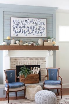 a living room with blue chairs and a fire place in the corner, on pinterest