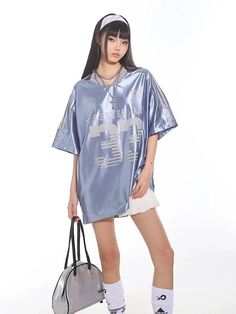 𝔇𝔢𝔱𝔞𝔦𝔩𝔰: Style: Y2k, Street fashion, Grunge Material: Cotton & Polyester This sporty fashion piece is perfect for a casual day out, offering a relaxed yet stylish look. Made with lightweight silky fabric, the soft blue shade adds a touch of sophistication to your street style ensemble. Made with premium material, perfect for summer! Free Shipping with over 80 $ purchase! We ship worldwide!! SIZE CHEST LENGTH S 50 in 28 in M 51 in 29 in L 52 in 30 in SIZE CHEST LENGTH S 126 cm 72 cmM 130 c Urban Style Blue Summer Tops, Urban Blue Tops For Summer, Trendy Oversized Sports Tops, Spring Streetwear Drop Shoulder Tops, Oversized Hip Hop Tops For Spring, Trendy Blue Drop Shoulder Tops, Blue Drop Shoulder Tops For Spring, Oversized Light Blue T-shirt For Summer, Blue Hip Hop Tops For Sports