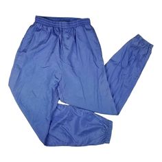 Vtg 90s G-4000 Nylon Track Pants Womens Sz L Blue Joggers Unlined Hip Hop Stretch waist and ankle cuffs 2 pockets 100% nylon Good condition with some light fading on the ankle cuffs. Gently worn.   See photos / Smoke free home  Tag Size:  Large *measurements in inches: Waist: 26    (stretched to fullest:36  ) Inseam: 28 Front Rise: 14.25 Leg Cuff (across): 5 * View Photos of measurements so you can see how I measure & determine for yourself.   *Compare measurements with a similar garment that yo Blue Hip Hop Pants With Pockets, 90s Style Blue Nylon Bottoms, Blue Nylon Pants For Jogging, Blue Nylon Sportswear Bottoms, 90s Track Pants, Blue Nylon Jogging Pants, Nylon Track Pants, Blue Joggers, Leg Cuffs