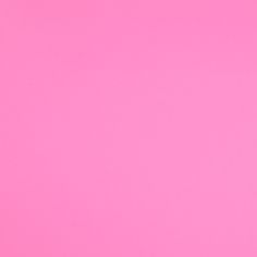 an airplane is flying in the sky on a pink background with copy space for text