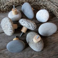 some rocks and screws on a wooden table