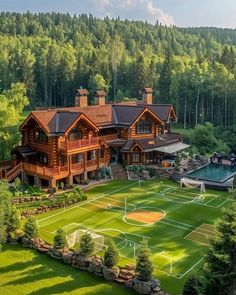 an aerial view of a house with a tennis court in the front yard and pool