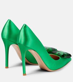 a pair of green high heeled shoes