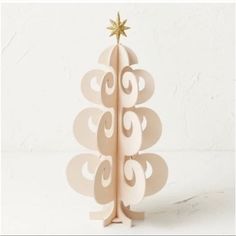 a cardboard christmas tree with a star on top