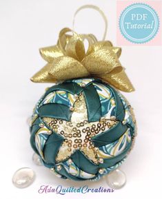 an ornament with a starfish on it and a ribbon tied around the top