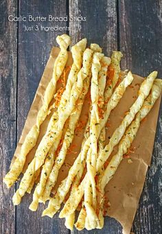 garlic bread sticks on a piece of brown paper