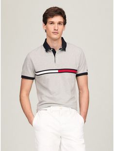 Tommy Hilfiger men's polo. What we do best, the classic polo in stretch pique cotton, cut in a comfortable, easy fit and featuring our embroidered stripe.  Material: 97% Cotton. Tommy Hilfiger Cotton Polo Shirt With Polo Collar, Tommy Hilfiger Cotton Polo Shirt, Classic Tommy Hilfiger Cotton Polo Shirt, Tommy Hilfiger Cotton Polo Shirt Short Sleeve, Classic Tommy Hilfiger Collared Polo Shirt, Fitted Tommy Hilfiger Polo Shirt With Short Sleeves, Fitted Short Sleeve Tommy Hilfiger Polo Shirt, Fitted Tommy Hilfiger Casual Polo Shirt, Casual Fitted Tommy Hilfiger Polo Shirt