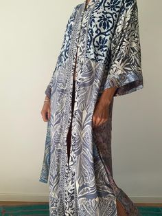 Long kimono, made in light and soft material  Comfy to wear around the house or as a street style coat  With front wrap tie belt  Loose fitting made free size of varieties materials with defferent prints very comfortable as a home gown or duster  as well as urban street style cover up, when layered over a tshirt and jeans very light and easy to wear more available at  https://www.etsy.com/shop/AltheaStores? One size Thank You for looking Oversized Robe With Kimono Sleeves For Beach Cover-up, Festival Robe With Printed Kimono Sleeves, Long Multicolor Kaftan For Loungewear, Silk Wrap Kimono For Loungewear, Multicolor Kaftan With Kimono Sleeves For Loungewear, Long Patterned Printed Kimono, Printed Kimono With Kimono Sleeves For Loungewear, Bohemian Long Patterned Kimono, Multicolor Long Kimono For Beach Cover-up