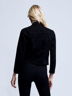 A slim denim jacket in saturated black. A crop cut, front angled seaming and welt pockets define the waist, accentuating an hourglass shape. Includes hems with clean raw edges, double-stitched chest pockets and cuffed three-quarter sleeves. Fastens in front with matte-black buttons. Fitted Black Denim Jacket For Work, Fitted Denim Jacket With Contrast Stitching And Long Sleeves, Fitted Denim Jacket With Contrast Stitching For Fall, Fitted Denim Jacket With Contrast Stitching, Fitted Washed Black Long Sleeve Denim Jacket, Fitted Long Sleeve Washed Black Denim Jacket, Fitted Washed Black Denim Jacket, Fitted Cropped Denim Jacket With Frayed Hem, Cropped Fitted Denim Jacket With Frayed Hem