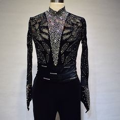 a black and silver suit with sequins on it