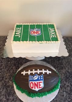 a cake that is shaped like a football and the number one on top of it