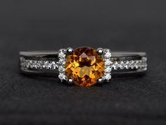 Welcome to my shop, you can find many beautiful gemstone jewelry here, and you also can ask for customized service. Main Stone: citrine, round cut 6X6mm, 0.80 carats Accent Stones: cz Metal: 925 sterling silver plated with rhodium. I also can provide metal options such as 14k solid yellow/white/rose goldSetting: prong setting If you want to know more rings please go to my shop home: https://www.etsy.com/shop/XCjewelryStudio?ref=hdr_shop_menuIt's a perfect gift for the person who was born in Nove Orange Round Jewelry With Brilliant Cut, Citrine Brilliant Cut Promise Ring, Citrine Ring With Center Stone, Yellow Topaz Ring For Anniversary, Yellow Topaz Promise Ring, Round Cut, Citrine Rings With Prong Setting, Citrine Rings With Accent Stones, Citrine Ring With Prong Setting, Yellow Topaz Ring With Center Stone