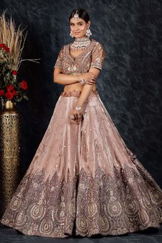 Onion pink flared tissue organza lehenga with spluttered sequin embellishments and Padma bloom gota-sequin embroidery. Paired with a flattering leaf neck blouse with bahar bloom gota-sequin embroidery and a sequin border embellished organza dupatta. - Aza Fashions Pink Tissue Silk Lehenga With Unstitched Blouse, Pink Tissue Silk Choli With Unstitched Blouse, Pink Tissue Silk Sets For Diwali, Pink Tissue Silk Lehenga With Pallu, Semi-stitched Pink Tissue Silk Lehenga, Pink Lehenga With Intricate Embroidery In Tissue Silk, Pink Tissue Silk Lehenga For Diwali, Pink Organza Choli With Cutdana, Festive Pink Lehenga In Tissue Silk