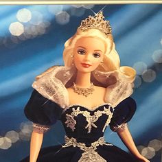 a barbie doll wearing a blue dress and tiara