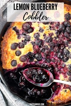 lemon blueberry cobbler in a cast iron skillet with a spoon resting on it