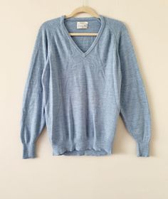 "Description: Vintage 70s/80s super soft Christian Dior light blue heather v-neck wool sweater made in USA. Condition:  Very Good. (Please see pics).  Measurements:  Approx. Length: 27\" HPS, Chest (Flat across the underarm): 22\" ALL SALES FINAL - Please check and compare measurements to something you own before purchasing. Most of my products are vintage/used, so please check pictures and feel free to ask questions. Thank you." Pullover Outfit, Sweater Making, Vintage Sweaters, Wool Sweaters, Vintage 70s, Vneck Sweater, Product Description, Christian Dior, Sweater Outfits