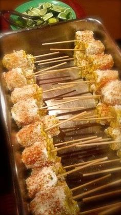 several skewers are lined up on a tray