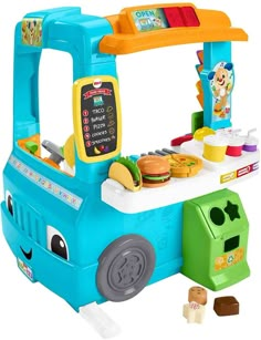 a toy food truck with various foods on it