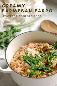 creamy parmesan farro in a white bowl