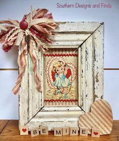 an old photo frame with a heart on it and the words be mine spelled in small letters