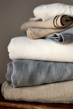 several folded linens stacked on top of each other