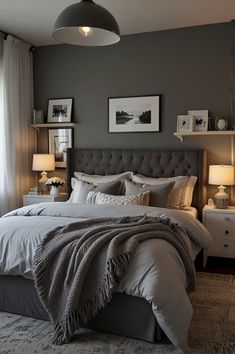 a bedroom with gray walls and white bedding