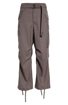 Fine wool-enriched suiting fabric brings a refined element to utility-inspired cargo pants detailed with plenty of pockets and drawstrings at the hems. 28 1/2" inseam; 20" leg opening; 13" front rise; 19" back rise (size 2) Zip fly with button closure Front slant patch pockets; cargo flap-patch pockets; back flap pockets Removable belt Drawstring hems Lined 70% polyester, 30% wool Dry clean Made in Japan Designer Clothing Asian & Pacific Islander Owned/Founded Fall Workwear Parachute Pants With Side Pockets, Pacific Islander, Suiting Fabric, Pants Details, Suit Fabric, Fabric Gift Bags, Nordstrom Store, Fabric Gifts, Free Fabric