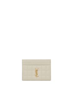 The Saint Laurent Cassandre Cardholder is the perfect minimalist accessory featuring five interior card slots, bronze-toned hardware and grosgrain lining. The wallet is detailed with the iconic YSL logo and carré-quilted overstitching. [tab] Composition: 100% Leather Size and Fit: Runs True to Size. 4.1" X 3.1" X 0.3". Care Instructions: Dry Clean Only Origin: Made in Italy SKU: STL48P207 Questions about size, fit, or how to style? The KZ team is here to help you look and feel your best! Chat wi Minimalist Accessories, Ysl Logo, The Saint, How To Style, Card Slots, Saint Laurent, Care Instructions, Card Holder, Dry Clean