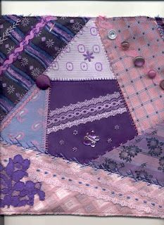 a patchwork quilt with buttons and lace