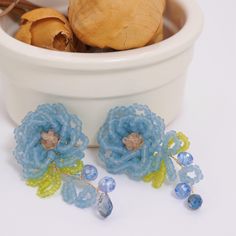 **Blue Flower-Shaped Beaded Handmade Earrings** Add a splash of color to your summer wardrobe with this  Blue Flower-Shaped Beaded Handmade Earrings. These vibrant, fun earrings are meticulously crafted to resemble delicate flowers, making them the perfect accessory for summer outfits and vacations. These earrings are not only eye-catching but also lightweight and comfortable to wear, ensuring you stay stylish all day long. Their playful design and bright blue hue bring a touch of whimsy to any Handmade Blue Beaded Earrings For Beach, Colorful Blue Beaded Earrings For Beach, Spring Party Earrings With Round Beads, Blue Dangle Earrings For Spring, Blue Flower Earrings For Spring Parties, Summer Party Flower Earrings With Colorful Beads, Blue Bohemian Earrings For Spring, Summer Party Flower Beaded Earrings, Spring Beaded Flower Drop Earrings