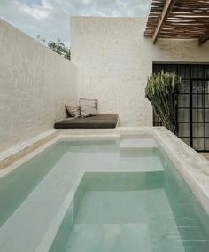 an indoor swimming pool in the middle of a house