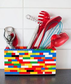 a colorful lego box with utensils in it