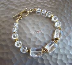 "Can be resize upon request. This handcrafted bracelet, featuring Genuine Quartz faceted beads and accented with Bali Silver Vermeil Gold beads. This bracelet is 7.5\" in length and finished with a Sterling Silver Vermeil Gold toggle clasp. **For the bracelets of this style the size of the bracelet needs to be approx. 1 inch larger than the wrist circumference to ensure a fairly tight fit. For a lightly loose fit, 1 ¼\" extra inch would work the best. For example: For the tight fit: wrist size i Colorful Statement Necklace, Silver Beaded Bracelet, Bracelet Summer, Leather Cord Bracelets, Sterling Silver Bead Bracelet, Cluster Bracelets, Bali Silver, Bracelet Display, Handmade Jewel