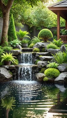 a small waterfall in the middle of a garden