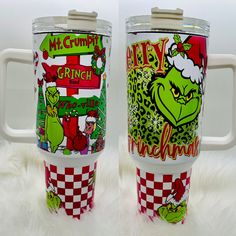 two christmas themed tumblers sitting next to each other