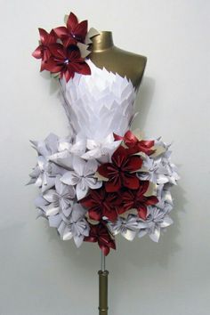 a mannequin made out of origami flowers