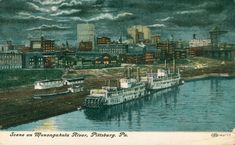 an old postcard shows boats docked in the water near a large city with tall buildings